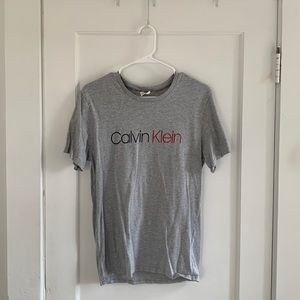 Calvin Klein Light Grey T-Shirt, Black and Red Text, Size Medium